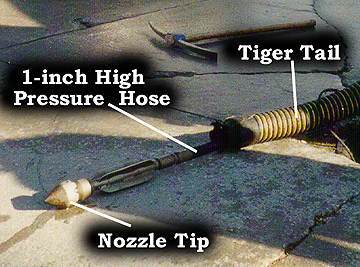 Photo 3: indicates location of nozzle tip, pressure hose and tiger tail