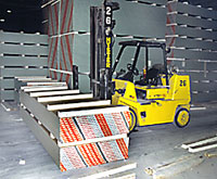 Photo of the forklift and stack of drywall